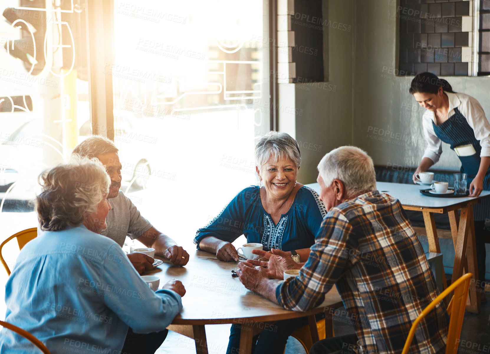 Buy stock photo Senior, friends and group relax at cafe on holiday or reunion on vacation in retirement. Elderly, people and talking at coffee shop with gossip, story or funny rumor in community chat in morning