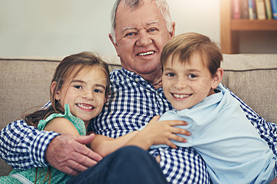 Buy stock photo Portrait of a happy brother and sister giving their grandfather a loving hug at home