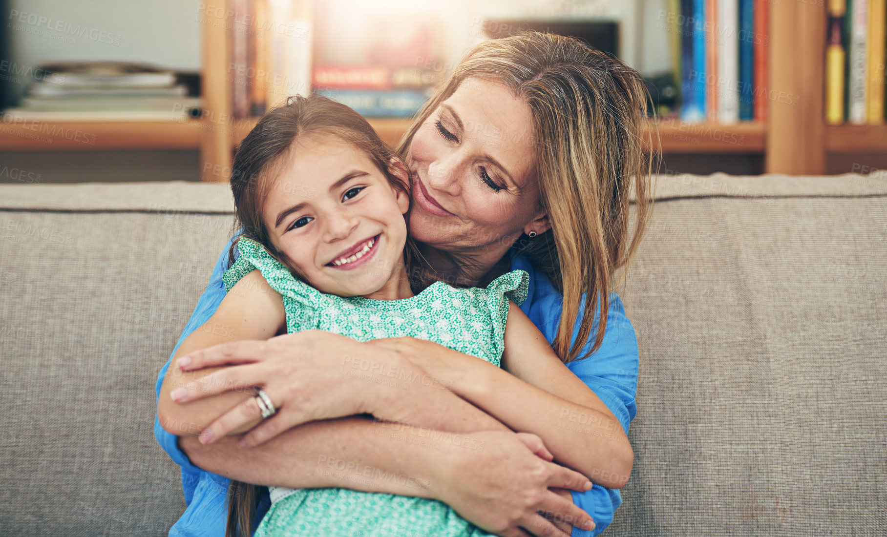 Buy stock photo Mother, girl and happy in home on sofa for love with bonding, support and care for child development. Parent, kid and smile for comfort on couch in living room together on break, relax and trust