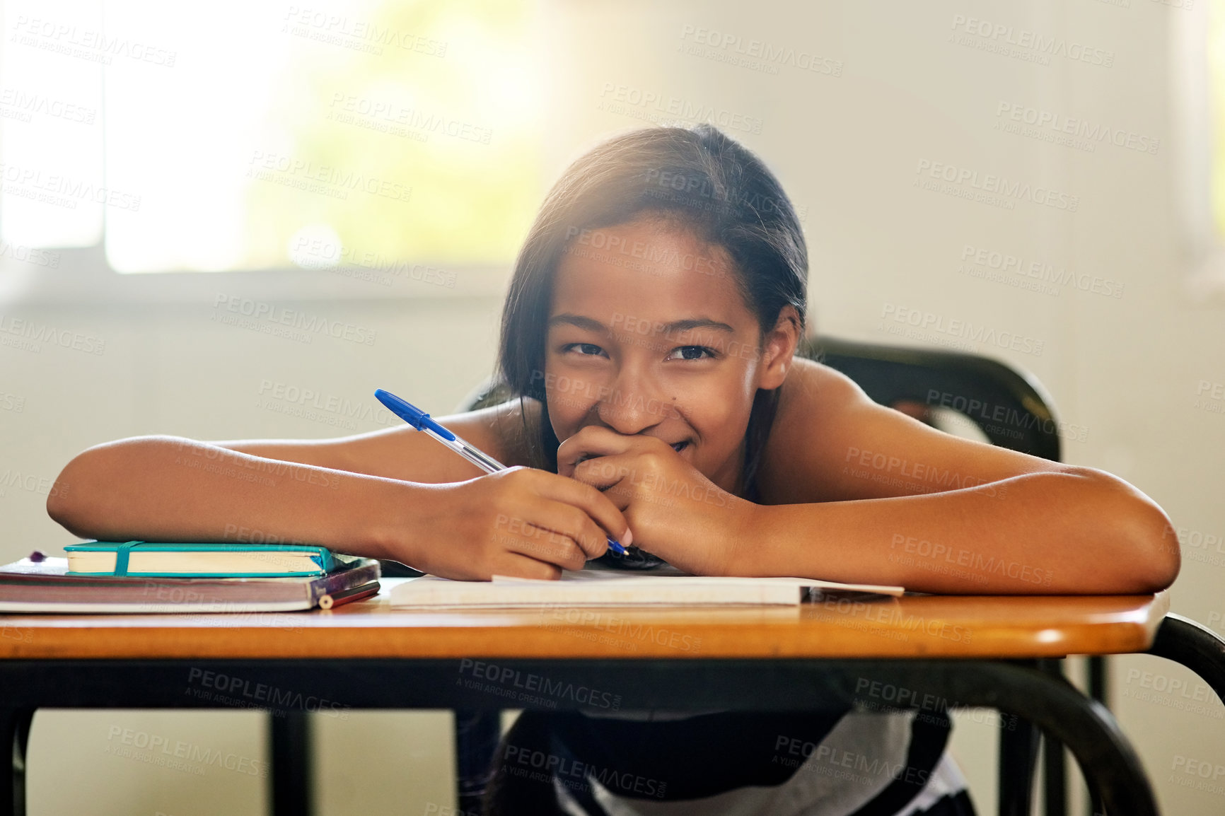 Buy stock photo Portrait, girl and smile with notebook in classroom at school for education, knowledge and lesson for child development. Female person, happy and satisfied as kid on writing for teaching or learning