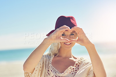 Buy stock photo Girl, heart and hands with portrait on beach for visual representation of expression for love, happiness and gratitude. Woman, romantic gesture or symbol and sign of affection, outdoor and support.