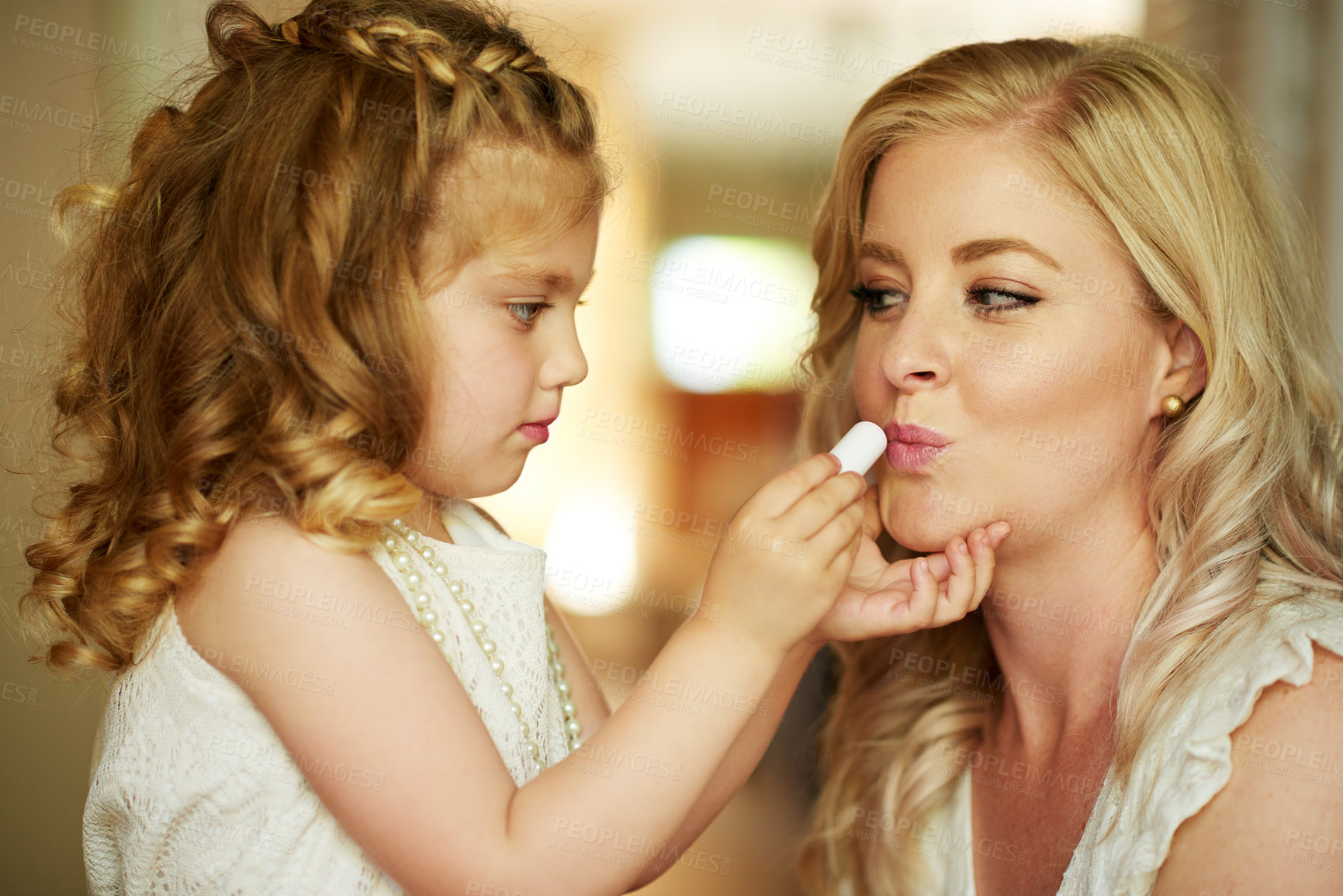 Buy stock photo Lipstick, mother and child with makeup in home for beauty, care or family bonding together. Girl, mom and kid apply lip cosmetics on face, playing or parent teaching to paint for help in bathroom