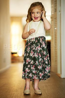 Buy stock photo Shot of an adorable little girl playing dress-up at home