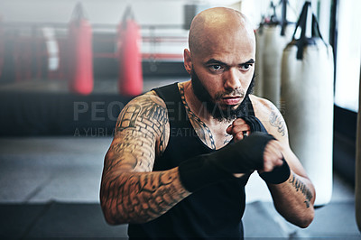 Buy stock photo Fitness, punching and man in gym for exercise, boxing challenge or competition training. Power, muscle and champion boxer at workout with confidence, fight and energy in MMA sports club with gloves.