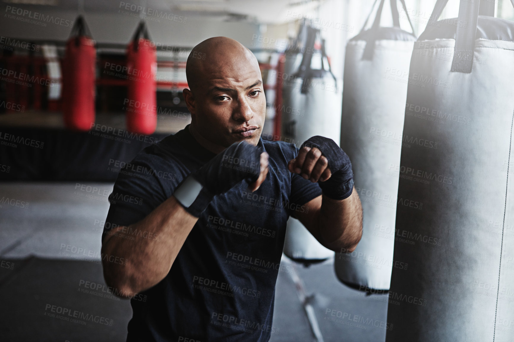 Buy stock photo Fitness, punching and portrait of man in boxing ring, gym challenge or competition training. Power, muscle and confident champion boxer at workout with confidence, fight and energy in MMA sports club