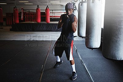 Buy stock photo Fitness, punching and portrait of black man in boxing gym for MMA, challenge or competition training. Power, muscle and champion boxer at workout with confidence, fight and energy in sports club.