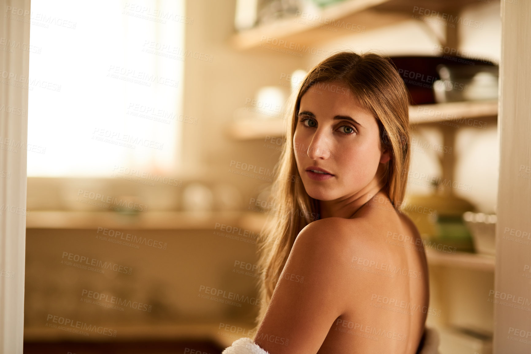 Buy stock photo Shot of a young woman relaxing in her bathrobe at home