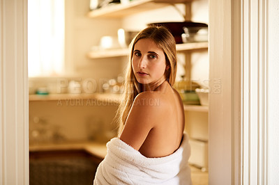 Buy stock photo Shot of a young woman relaxing in her bathrobe at home