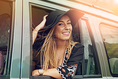 Buy stock photo Portrait of a young woman leaning out the window of a car while on a roadtrip