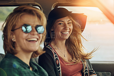 Buy stock photo Portrait of two young friends enjoying a roadtrip together