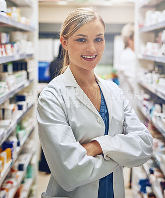 Buy stock photo Intern, pharmacy or portrait of woman with arms crossed or pharmacist in healthcare clinic or drugstore. Proud, smile or confident medical worker by shelf for pills medication or medicine to help