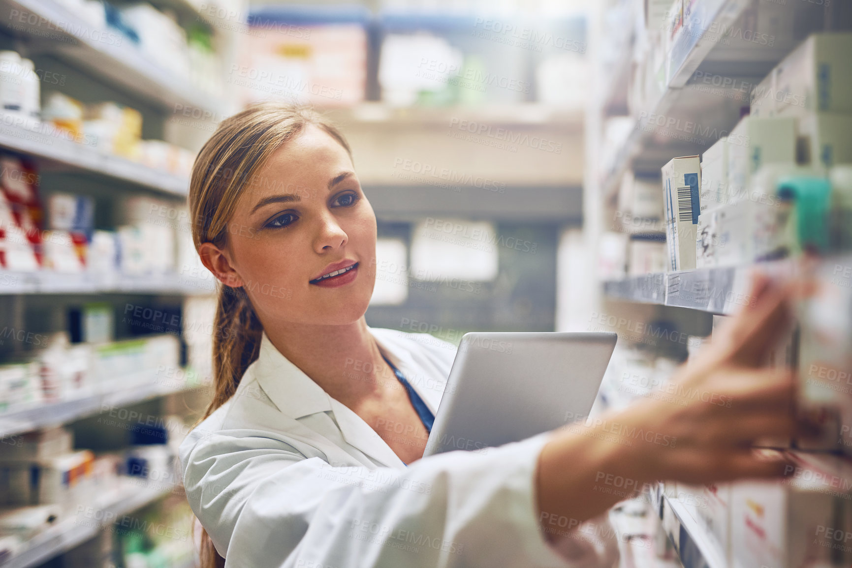 Buy stock photo Medicine, woman pharmacist with tablet and looking for prescription in an isle at the pharmacy or clinic. Healthcare, pharmaceutical and female person search for medication with digital device