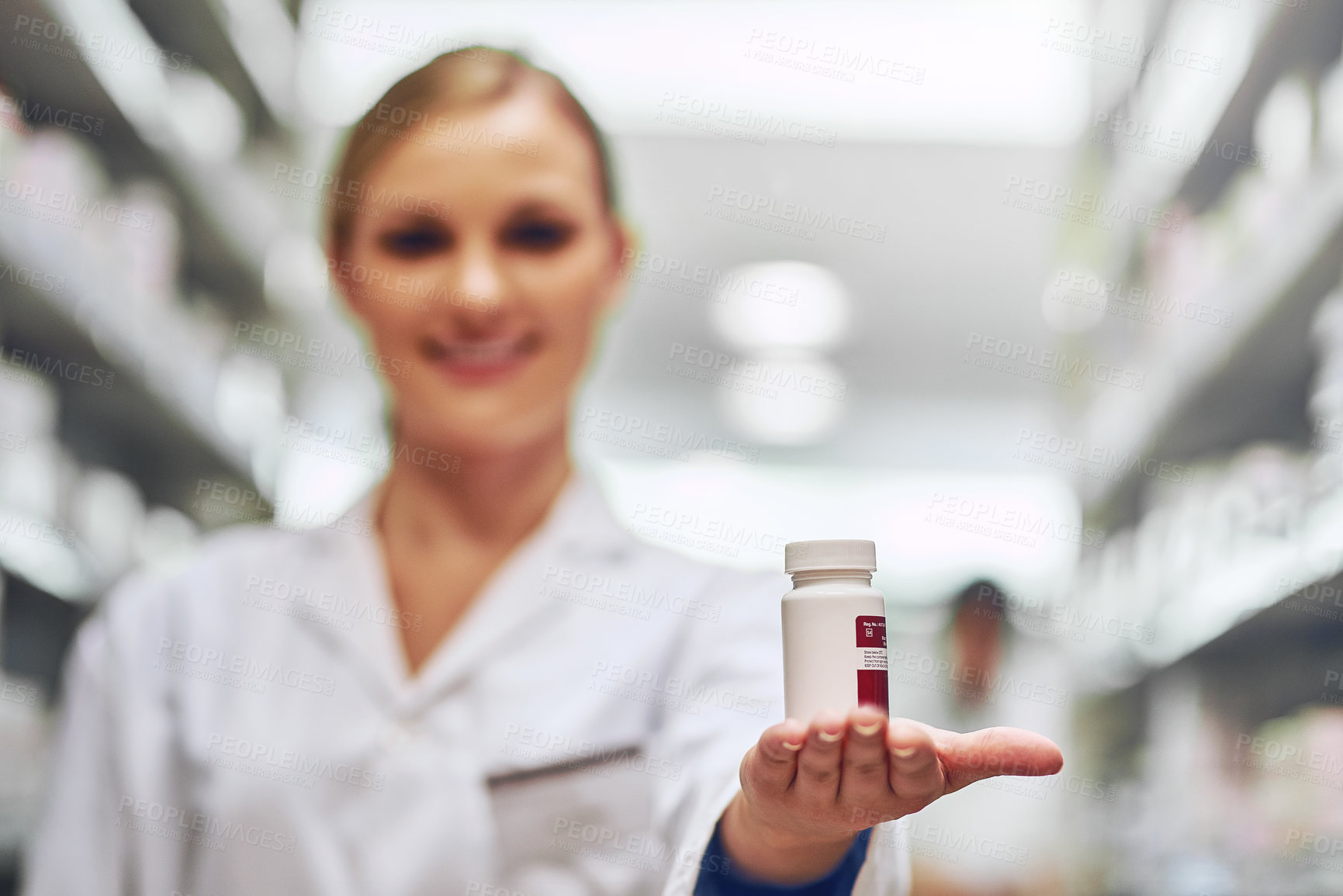 Buy stock photo Cropped shot of a pharmacist recommending medication
