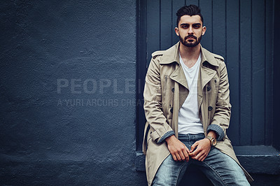Buy stock photo Portrait of a fashionable young man wearing urban wear and posing against a gray background