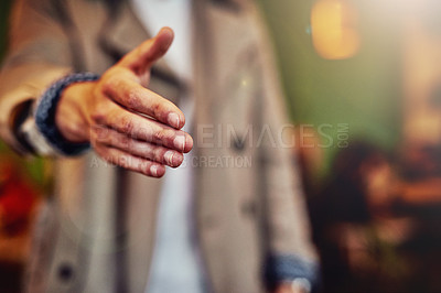 Buy stock photo Cropped shot of an unrecognizable young man extending his arm to shake hands