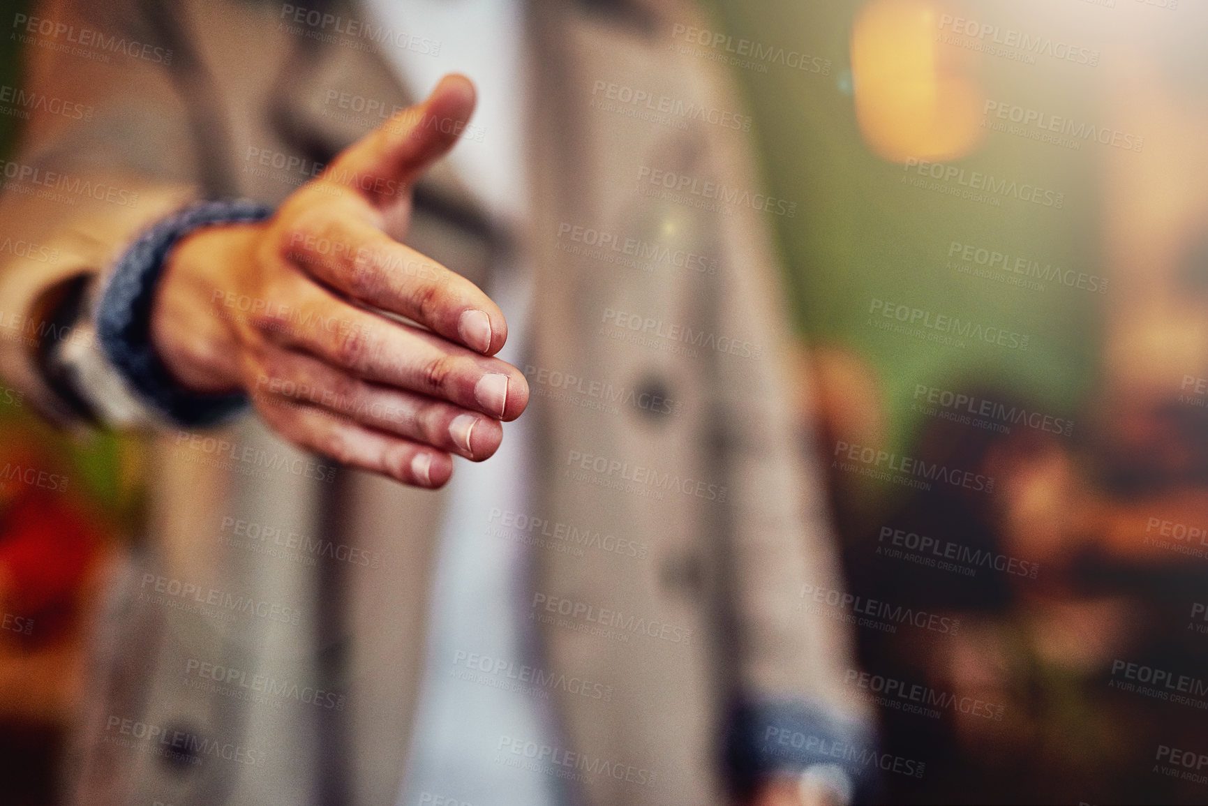 Buy stock photo Cropped shot of an unrecognizable young man extending his arm to shake hands