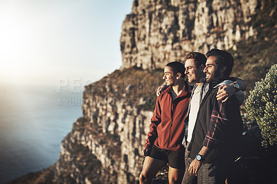 Buy stock photo Shot of a group of friends admiring the view while hiking in the mountains