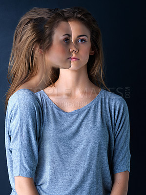 Buy stock photo Multiple exposure studio shot of a teenage girl posing against a dark background