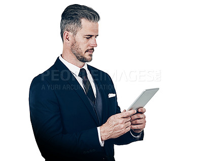 Buy stock photo Studio shot of a businessman using a digital tablet against a white background