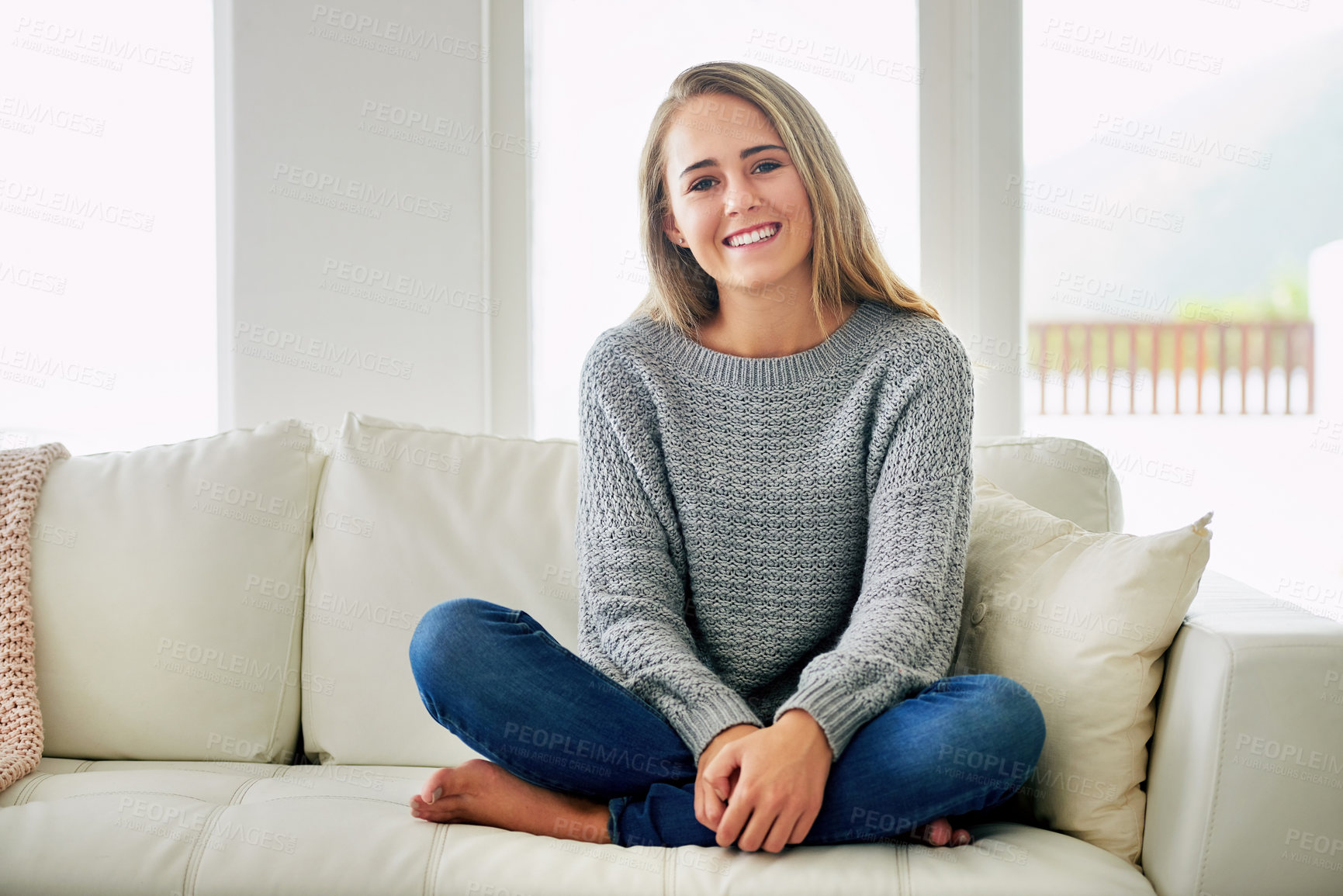 Buy stock photo Portrait, crossed legs and woman on couch, relax and happiness with peace, resting and calm in living room. Face, apartment and person on sofa, cheerful and comfortable with weekend break in house