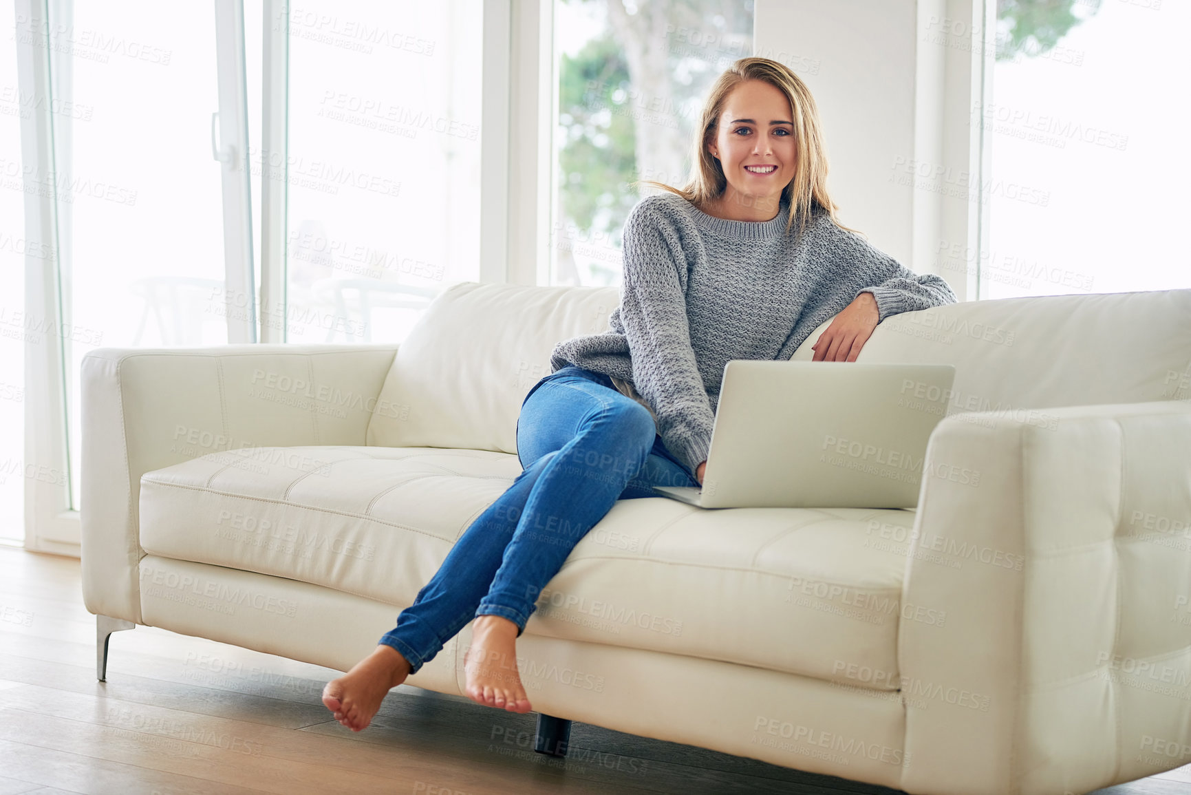 Buy stock photo Portrait, home and woman on sofa, laptop and streaming service for entertainment. Face, person and girl on couch, computer and watching film with internet, connection and website for movie and series