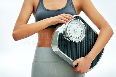 Buy stock photo Woman, fitness and scale in studio on white background for self care, weight loss and results. Female person, body and sportswear with progress, diet and health for wellbeing, wellness and workout