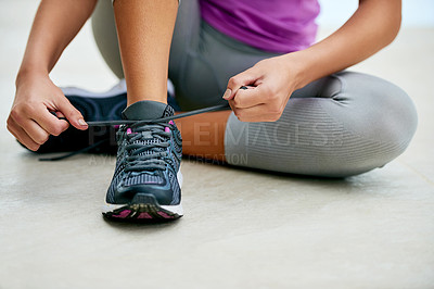 Buy stock photo Hands, tie and woman with shoes for exercise fashion or start of fitness routine on floor with feet. Workout, gear or runner prepare sneakers for training in gym with laces and closeup on footwear