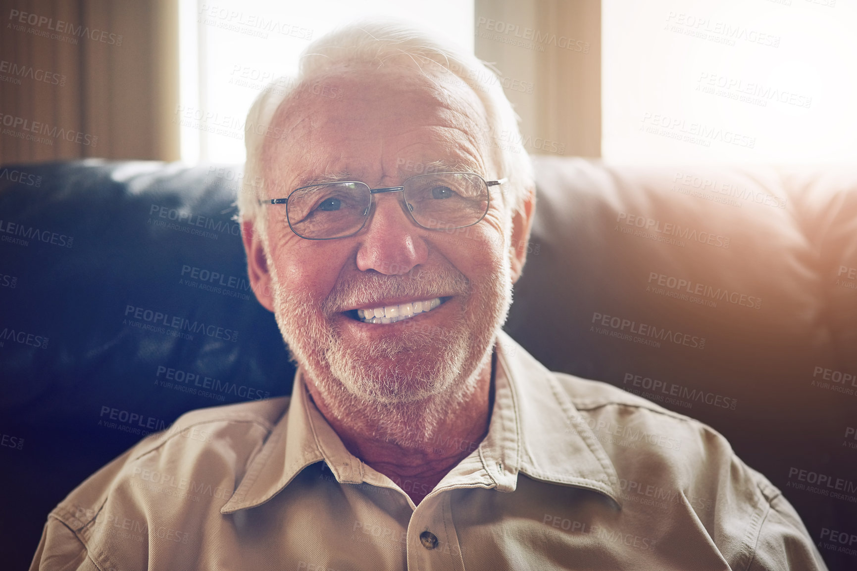 Buy stock photo Portrait, senior man and smile on sofa in living room for relax, retirement or good mood. Happiness, pensioner and elderly person with wisdom for confidence, comfortable or satisfaction in home