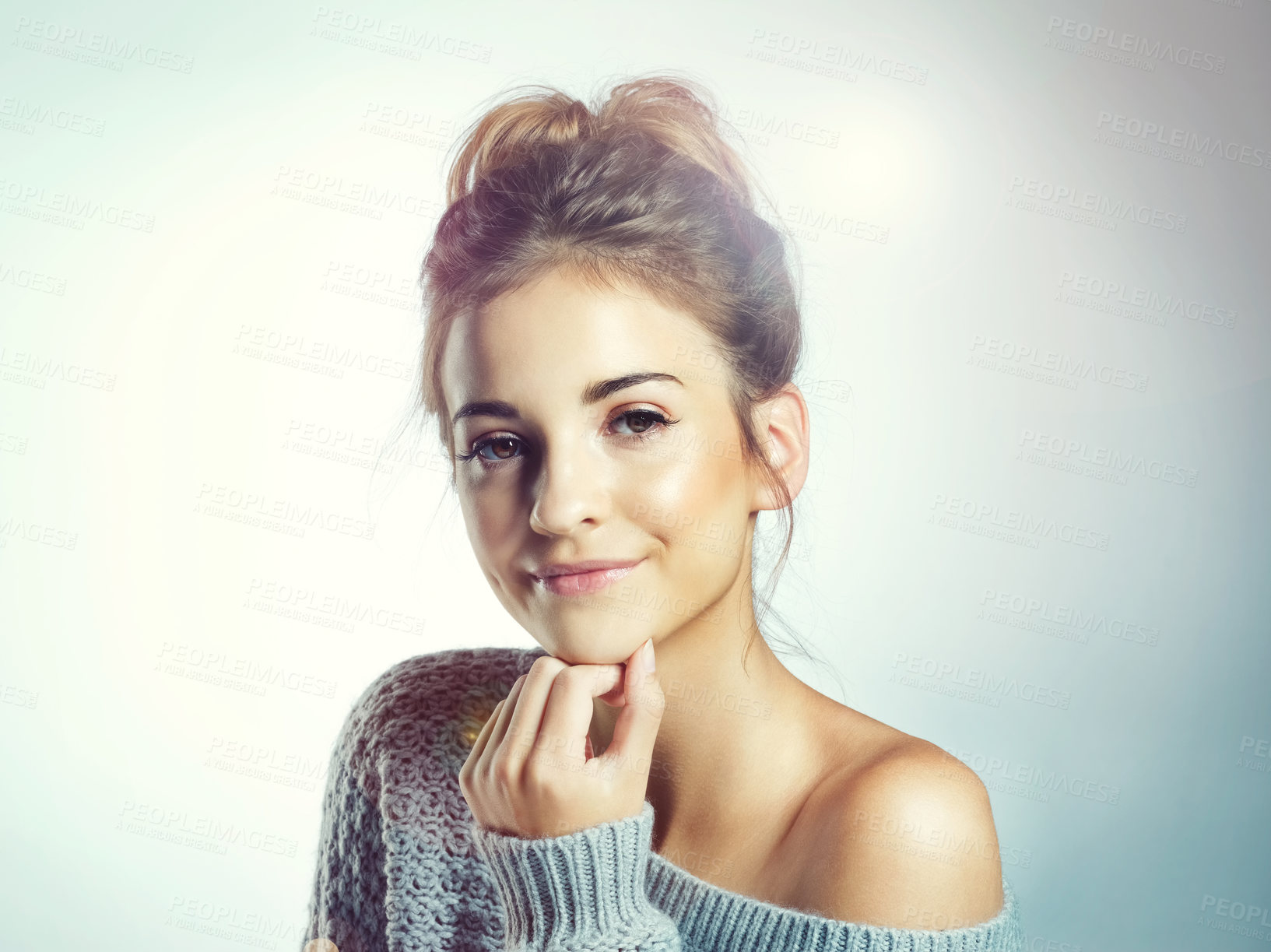 Buy stock photo Cropped shot of a beautiful young woman posing in the studio