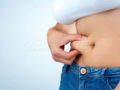 Buy stock photo Woman, hands and stomach pinch in studio for weight loss or health, body transformation or diet for wellness. Female person, white background and abdomen with mockup for results with progress