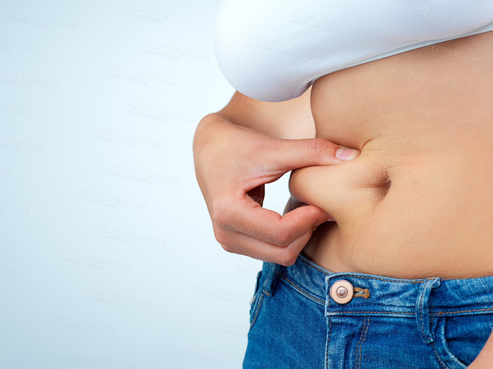 Buy stock photo Woman, hands and stomach pinch in studio for weight loss or health, body transformation or diet for wellness. Female person, white background and abdomen with mockup for results with progress