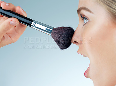 Buy stock photo Woman, surprise and nose with makeup brush in studio for cosmetic, beauty and foundation of aesthetic. Female person, wow and salon tools for glamour, transformation and glow on blue background