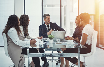 Buy stock photo Shot of a group of colleagues having a meeting in a modern office