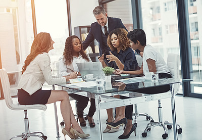 Buy stock photo Shot of a group of colleagues having a meeting in a modern office