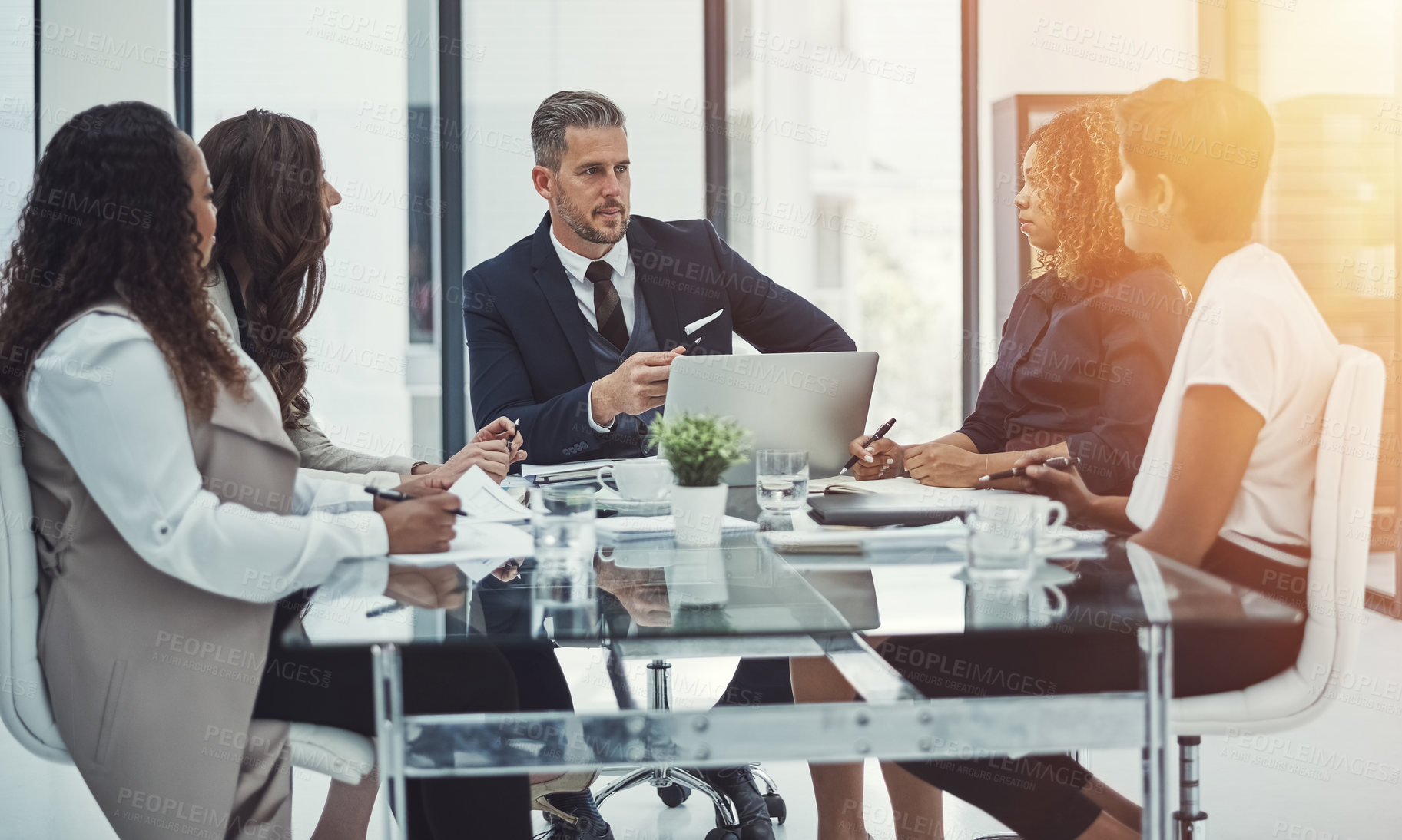 Buy stock photo Shot of a group of colleagues having a meeting in a modern office