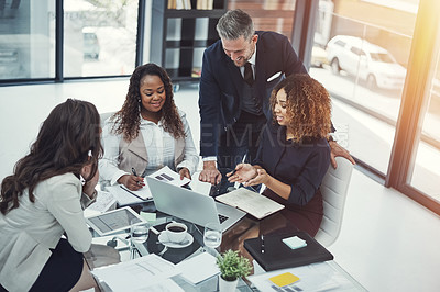 Buy stock photo Shot of a group of colleagues having a meeting in a modern office