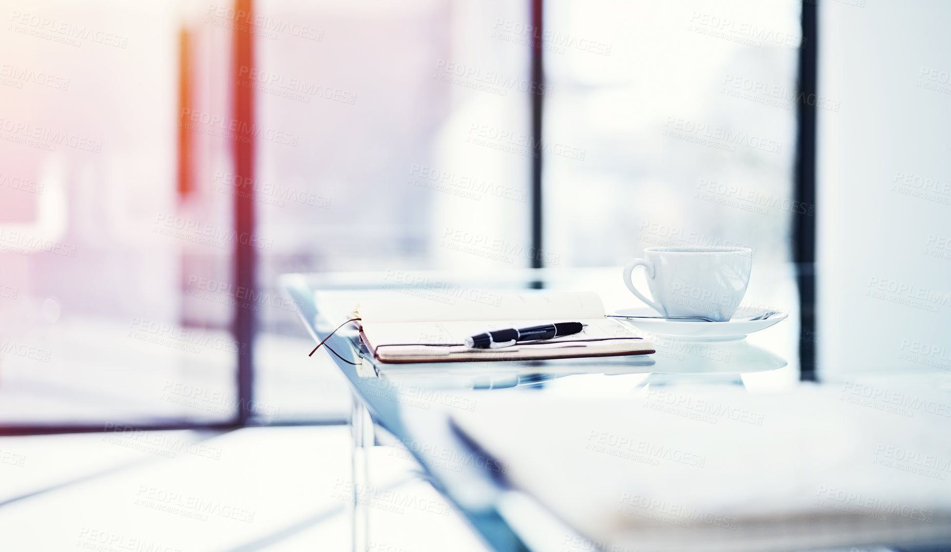 Buy stock photo Shot of a diary lying on a table in an empty office