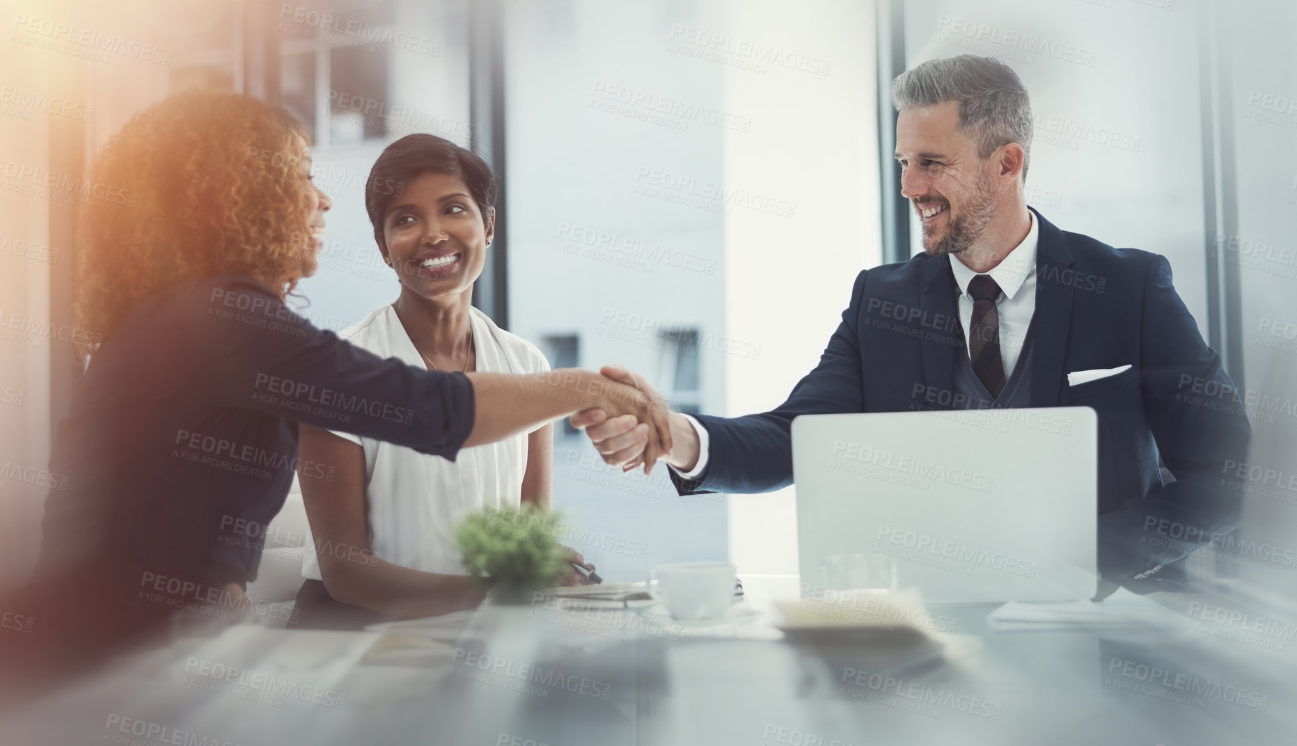 Buy stock photo Shot of a group of businesspeople having a meeting in the boardroom