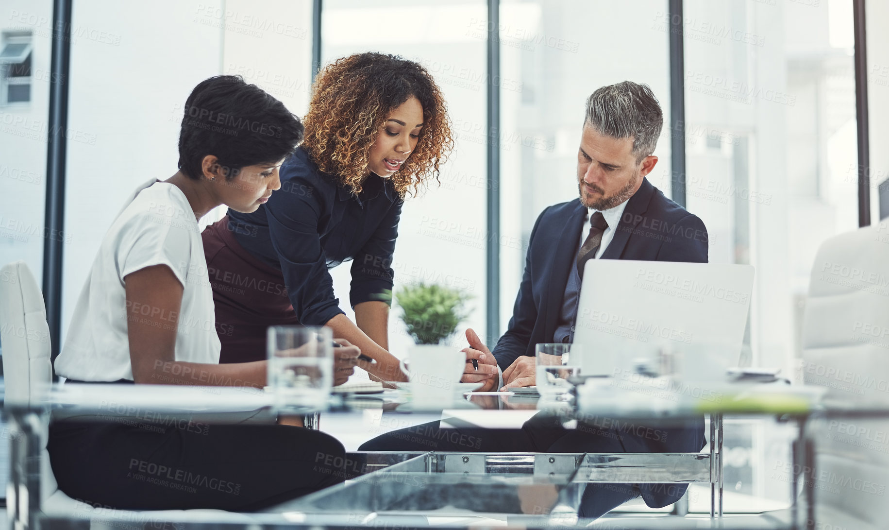 Buy stock photo Shot of a group of businesspeople having a meeting in the boardroom