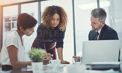 Buy stock photo Shot of a group of businesspeople having a meeting in the boardroom