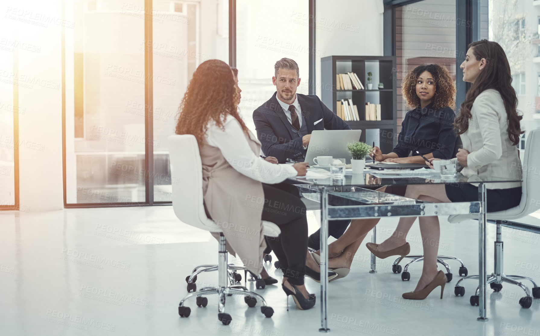 Buy stock photo Shot of a group of colleagues having a meeting in a modern office