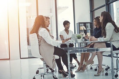 Buy stock photo Shot of a group of colleagues having a meeting in a modern office