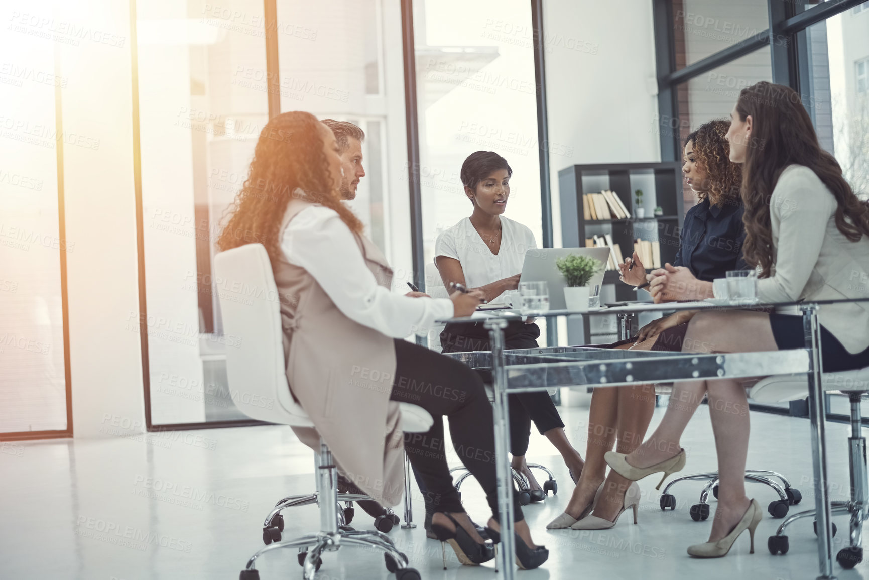 Buy stock photo Shot of a group of colleagues having a meeting in a modern office