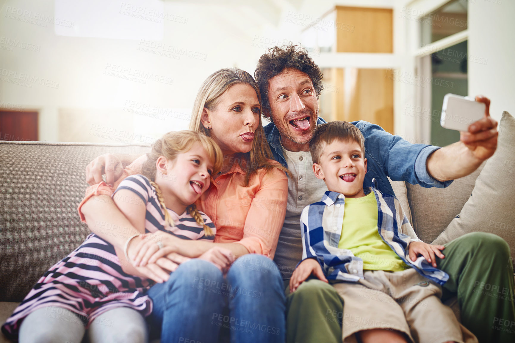 Buy stock photo Happy family, silly face and sofa with selfie for photography, funny picture or memory together at home. Mother, father and goofy children for bonding, holiday or weekend moment on couch at house