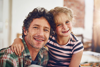 Buy stock photo Portrait of a father and his little daughter bonding together at home