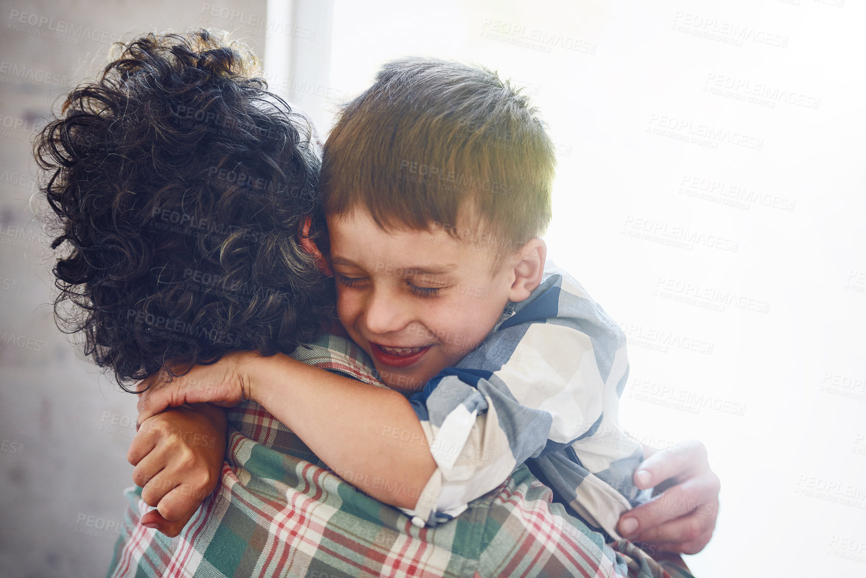 Buy stock photo Kid, father and happy for hugging in house, greeting and caring for relationship bonding with people together. Embrace, love and child development with family home, door and comfort with boy