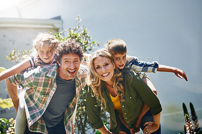 Buy stock photo Portrait of a happy family spending time together outdoors