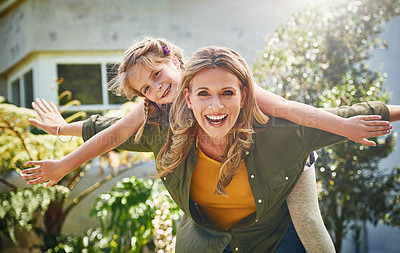 Buy stock photo Happy mother, portrait and piggyback with daughter for bonding, holiday or weekend in backyard at home. Mom, child or little girl with smile for flying, playing or support for outdoor day together