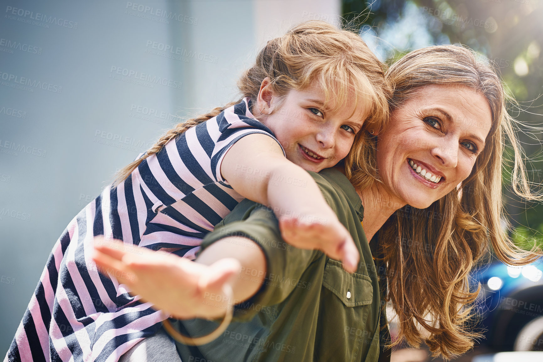 Buy stock photo Happy mother, portrait and piggyback with little girl for bonding, holiday or weekend in backyard at home. Mom, child or daughter with smile for flying, playing or support for outdoor day together