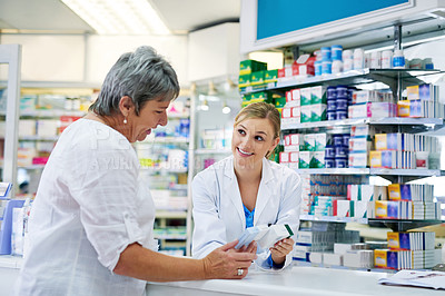 Buy stock photo Pharmacist explaining medicine to a woman in the pharmacy  for pharmaceutical healthcare prescription. Medical, counter and female chemist talking to a patient about medication in a clinic dispensary